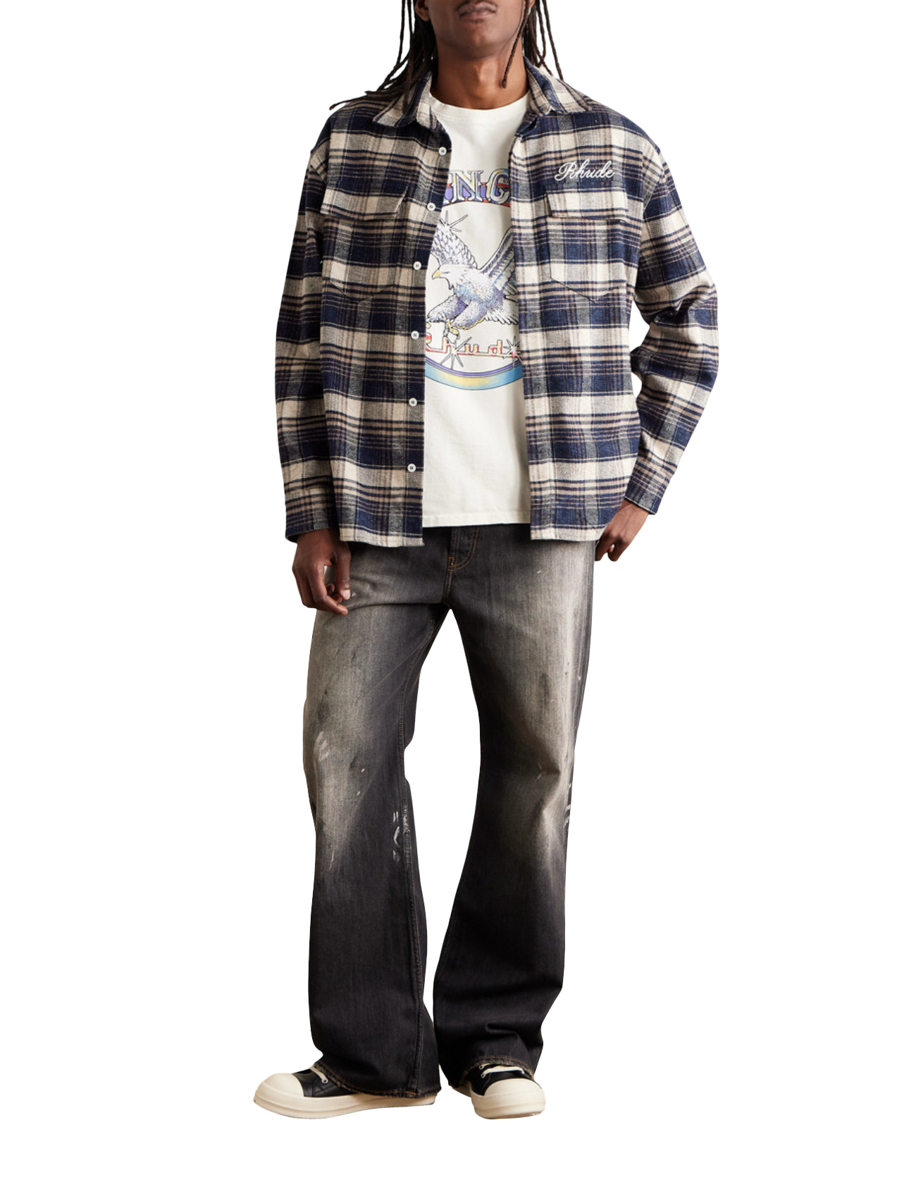 Model wearing Rhude Script Logo Flannel shirt over graphic tee with jeans